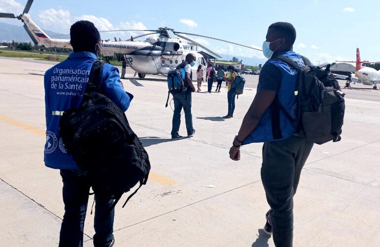Team of PAHO/WHO experts boarding UNASS helicopter to the South of Haiti following eathquake.