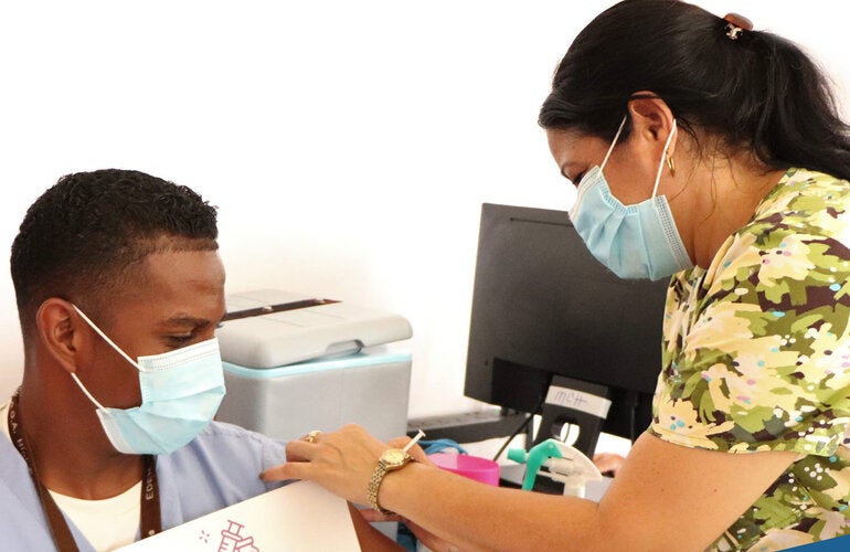 Man receives COVID-19 vaccination