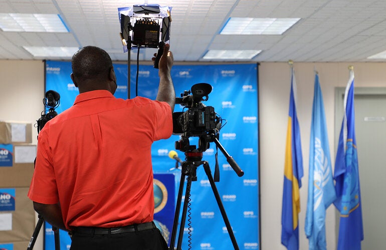 Videographer preparing for briefing