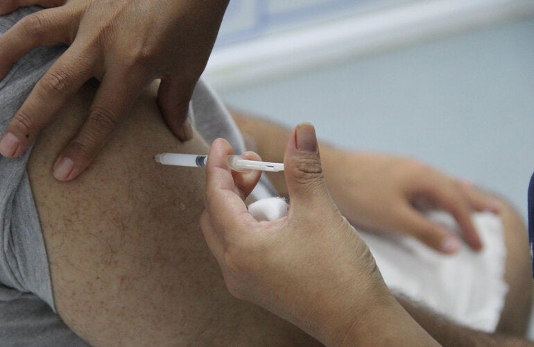 Man gets COVID-19 vaccine