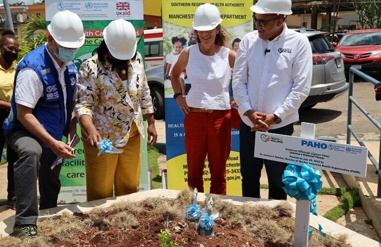 Dr. Etienne (second left) is pictured moments after planting Jamaica's national tree. Looking on (L-R) are PWR Stein, High Commissioner Judith Slater, British High Commission to Jamaica and Hon. Christopher Tufton, Minister of Health and Wellness in Jamaica