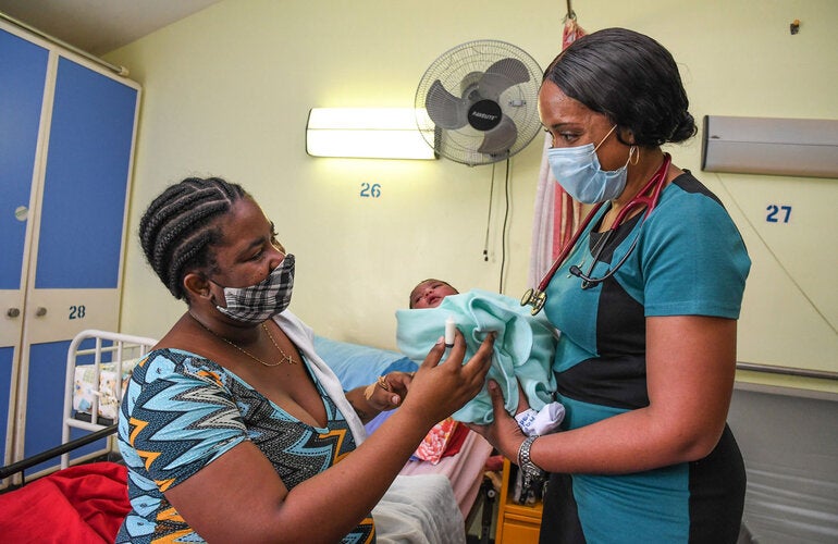 Mother with child receiving medical care