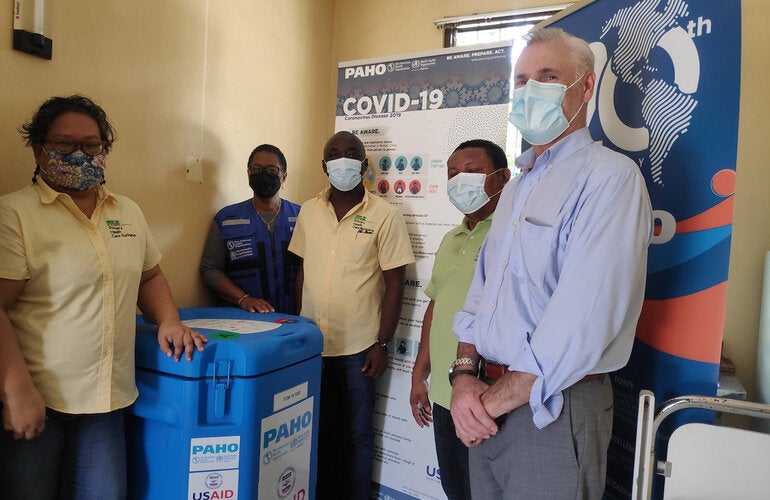 Medical Mission Director Dr. Maureen van Dijk,PAHO/WHO Representative Dr. Karen Lewis-Bell, Medical Mission Dr. Thompson Danso, Medical Mission Health Care Assistant Karel Wajacabo, and Mr. Philip Schwehm, Senior Development Advisor and Regional Economist for USAID in Eastern & Southern Caribbean during the handover.