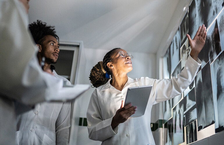 Doctors looking at xrays