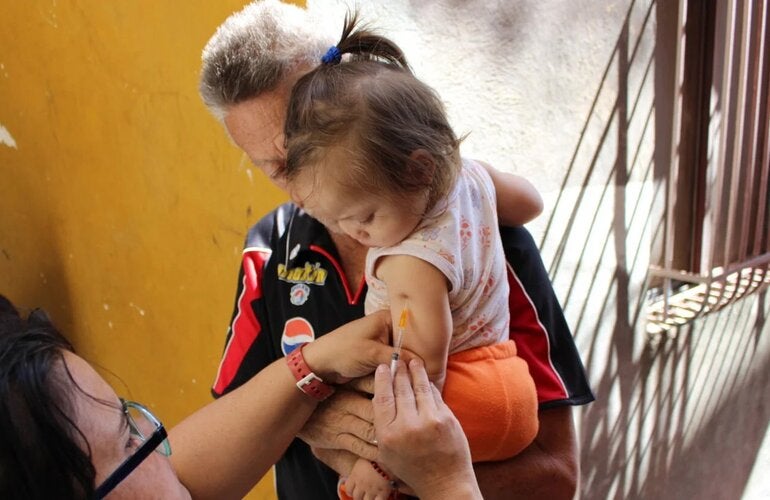girl receiving measles