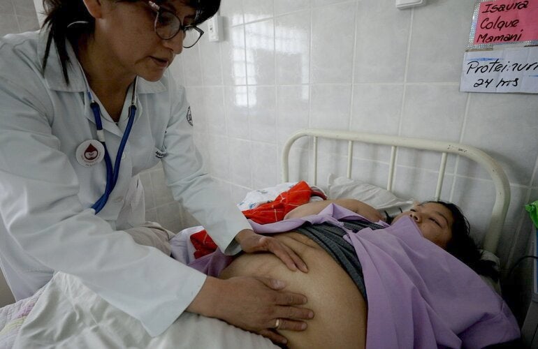 Pregnant woman receiving medical attention