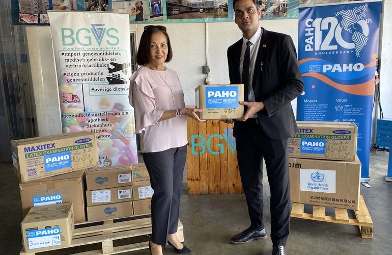 PAHO/WHO Representative Suriname Dr. Lilian Reneau-Vernon, and Minister of Health Dr. Amar Ramadhin during the handover of medical equipment and supplies 