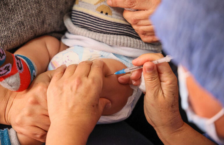 Young child receives vaccines