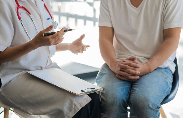 Patient talks to health care providor