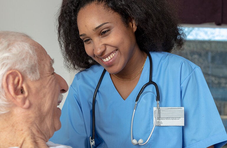 Nurse caring for elder patient