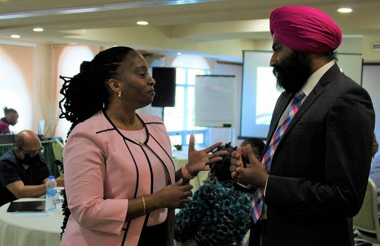 Rasheemah Cheltenham-Niles, Director Planning and Research Unit and Acting PAHO/WHO Representative for Barbados, Dr Prabjhot Singh.
