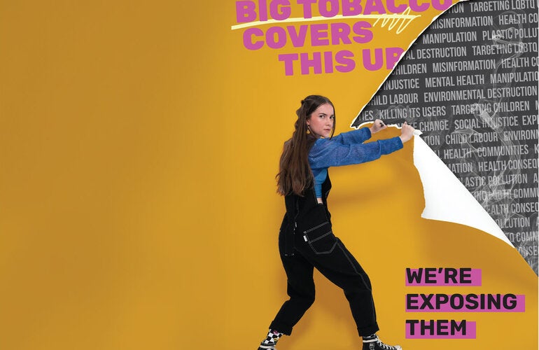 Tenn peels off wall with information on the harm of tobacco