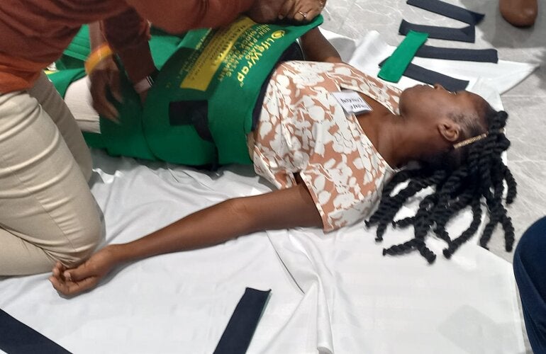 Health Care Workers practicing the use of Non-pneumatic Anti-shock Garment (NASG) for control of Post Partum Haemorrhage