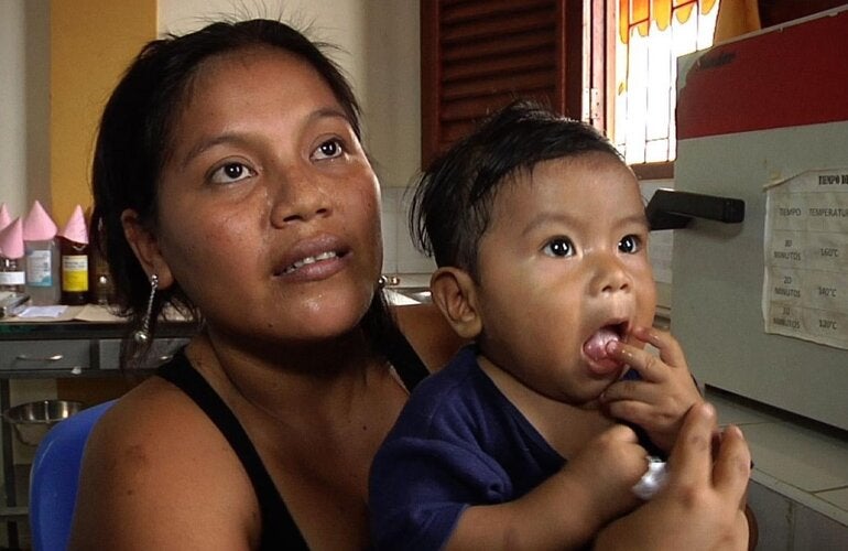 woman with toddler on her lap