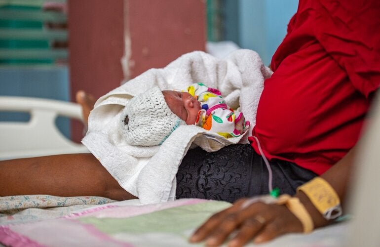 Newborn with his mother