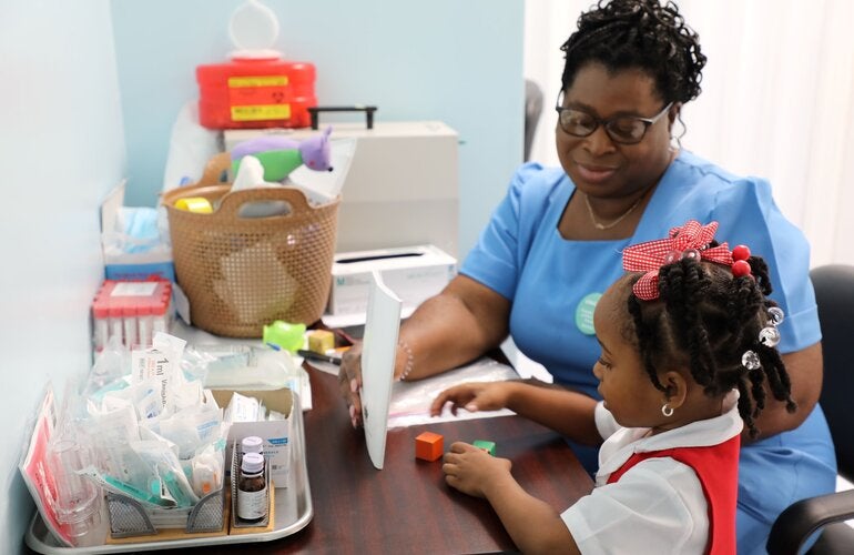 Nurse with little girl