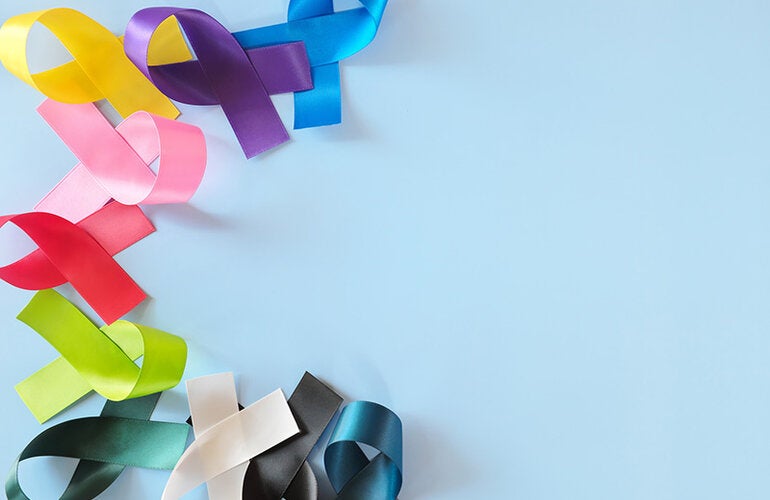 colorful cancer awareness ribbons on blue background