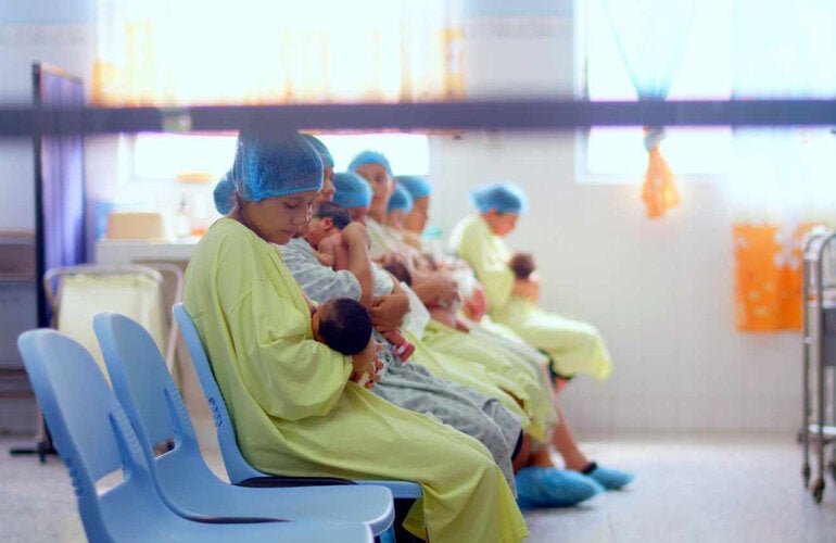 mothers breastfeeding newborns