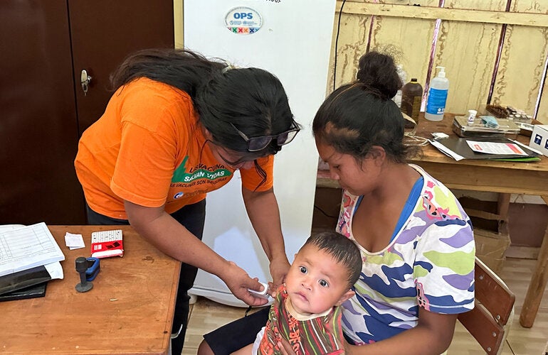 A child receives a medical examination