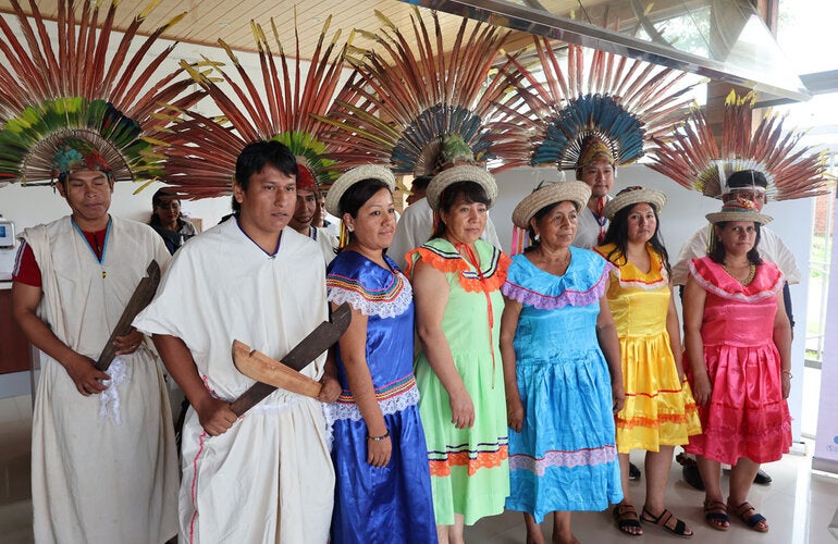Two men and five women, member of the Information Analysis Committee, Indigenous Network, Cochabamba Tropic region pose for the camera. 