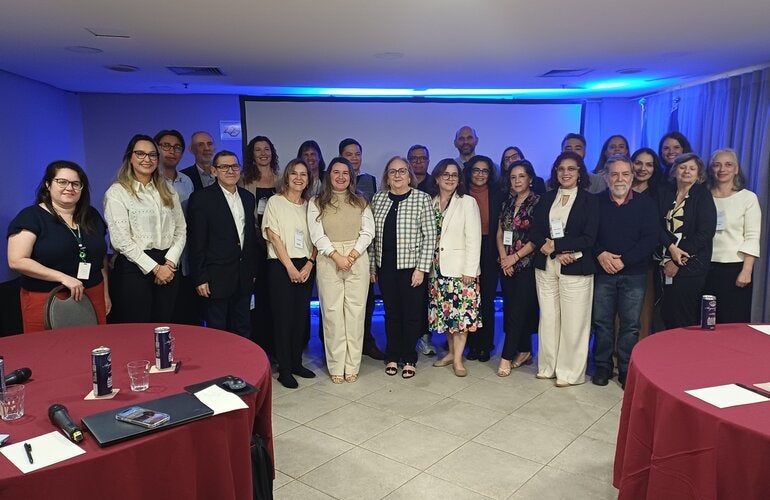Participants of the PAHO inter-programmatic meeting in São Paulo, held in August 2025, pose together in a conference setting. The meeting brought together specialists from Latin American countries and technical teams from BIREME, PAHO Brazil, and PAHO/WHO headquarters to discuss guidelines on the integrated surveillance of vertical transmission of the Oropouche virus.