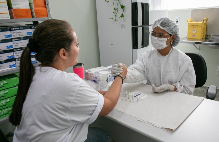 nurse and patient handshake