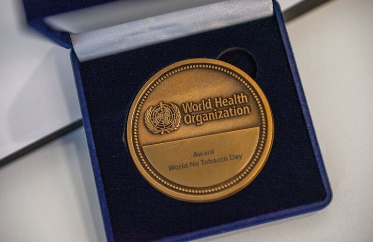 World No Tobacco Day award medal in a blue box.