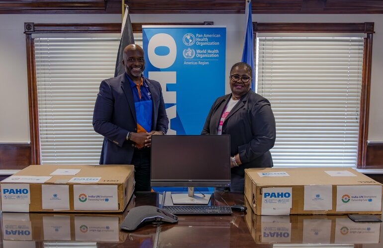 Dr. Anton Best, HSS Advisor (PAHO/WHO) presents the donations to Dr. Keva Thompson, Deputy Managing Director of the Public Hospital Authority. 
