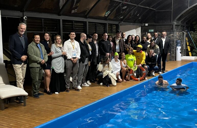 people standing by the pool