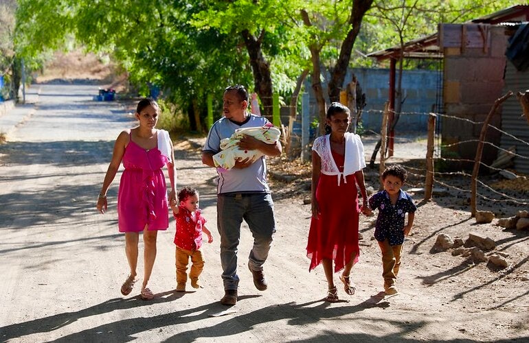 family walking down a rural street