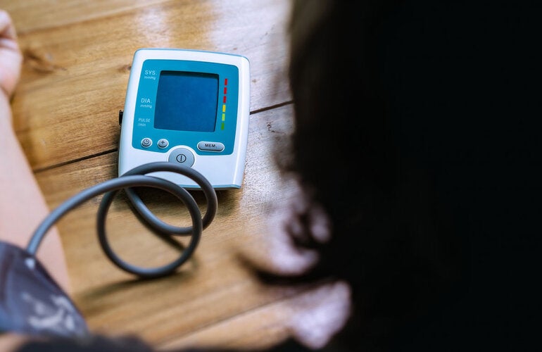 Woman checking her blood pressure