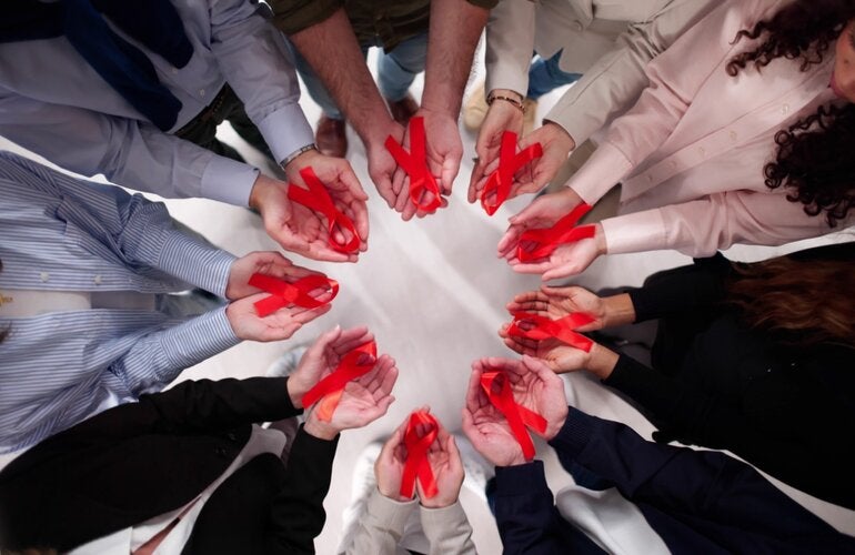 in a circle holding ribbons