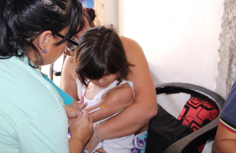 child getting vaccine