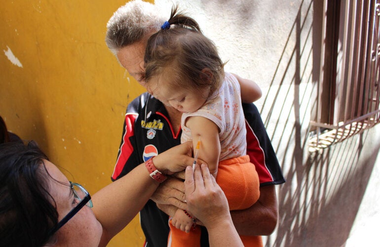 Little girl receives vaccine