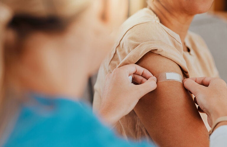 Vacccinated patient gets a band aid