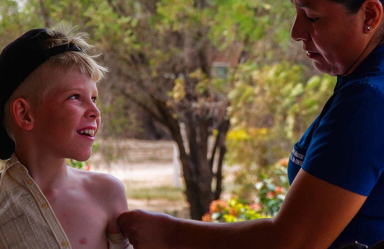 menonite boy recieves vaccination