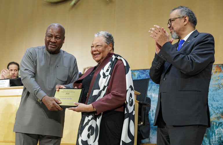 Dr Merceline Dahl-Regis receiving her award from President of the Republic of Ghana H.E. John Dramani Mahama and WHO Director-General Dr Tedros Adhanom Ghebreyesus.