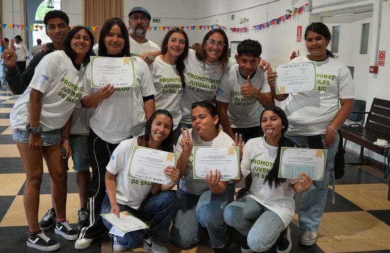 Young participants group photo holding up certificates