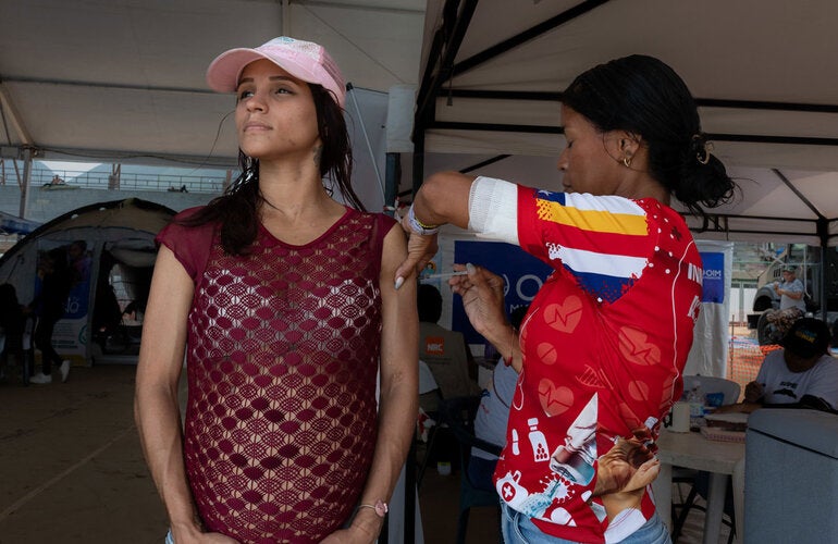Pregnant woman receives vaccine in Venezuela