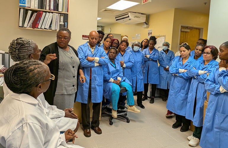 Assessment team with laboratory staff