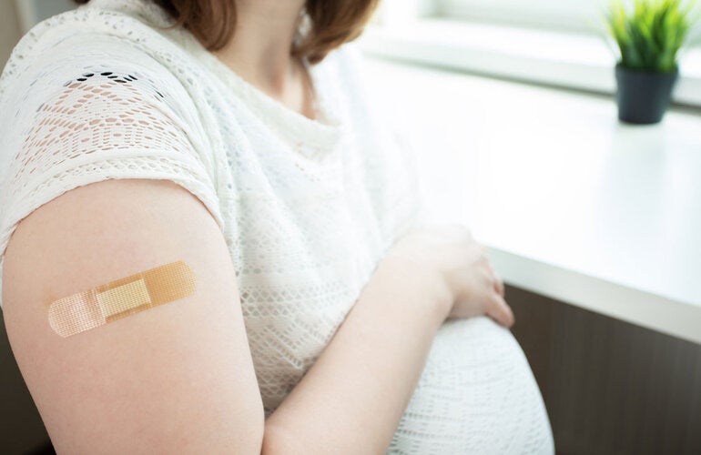 Pregnant woman after being vaccinated