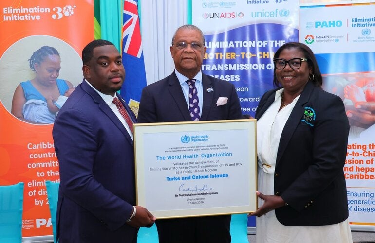 "Reception of the certificate by Hon. Kyle Knowles, Minister of Health and Human Services, Hon. Charles W Misick, Premier Turks and Caicos Islands and Desiree Lewis, Permanent Secretary, Ministry of Health and Human Services.