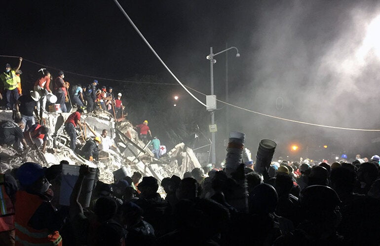mexico earthquake rescue workers on rubble