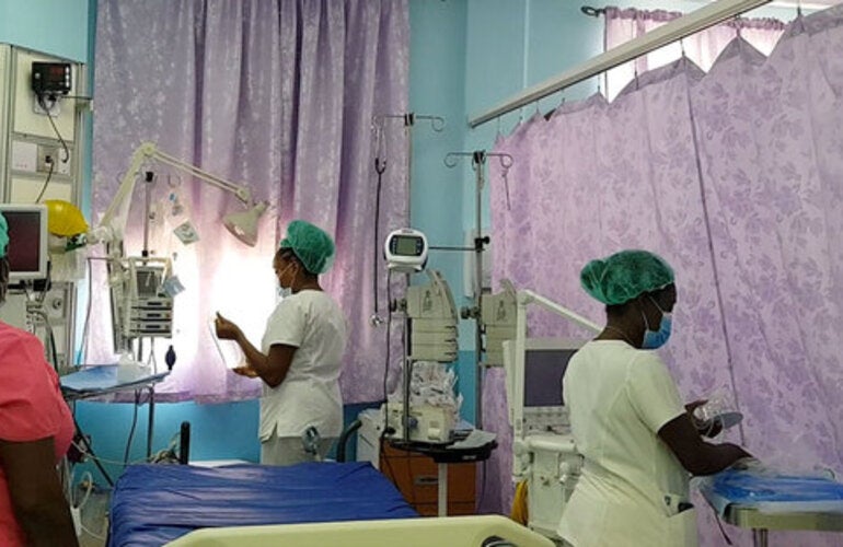 nurses organizing beds in a hospital