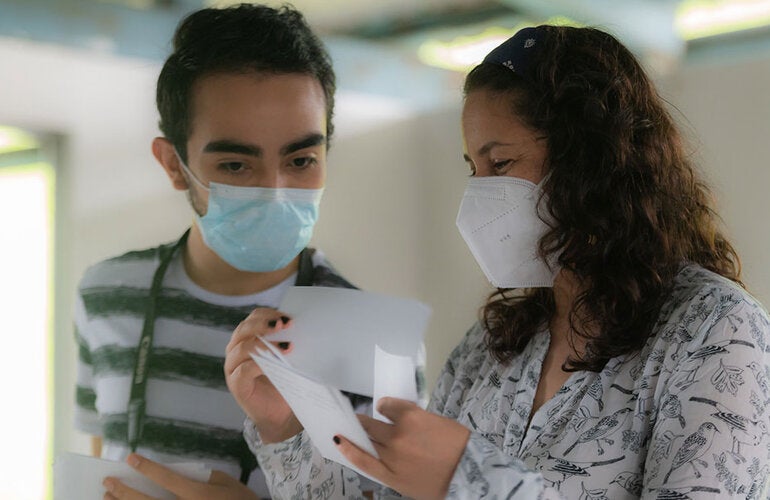 Patients looking and holding a prescription