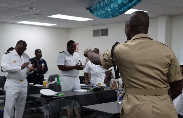  Assistant Superintendent Audley Peters of The Royal Bahamas Police Force led participants in an interactive activity prior to his presentation. 
