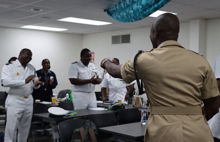  Assistant Superintendent Audley Peters of The Royal Bahamas Police Force led participants in an interactive activity prior to his presentation. 