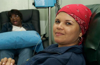 woman with bandana smiling