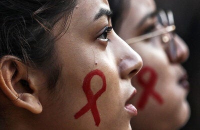 people with HIV ribbon painted onto their faces