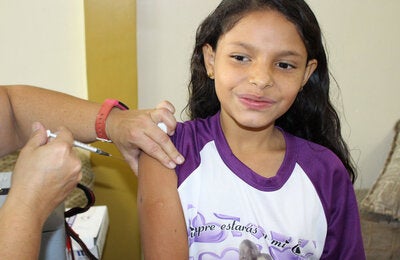 Girl being vaccinated